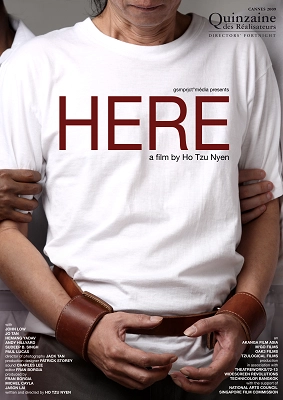 Film poster for "Here" by Ho Tzu Nyen, featuring a person wearing a white t-shirt with the movie title in red letters.